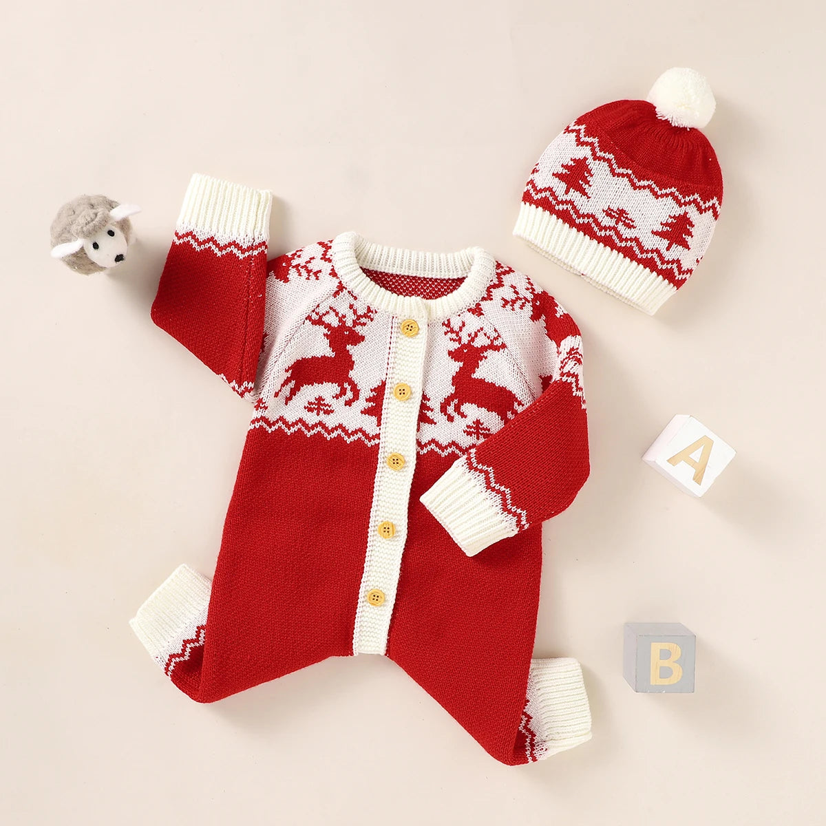 Red and white winter knit rompers for babies with reindeer pattern and matching hat set