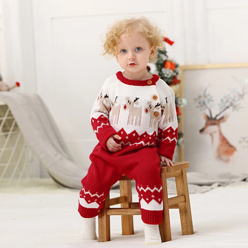 Red and white winter knit rompers for babies with reindeer pattern and button details for toddlers