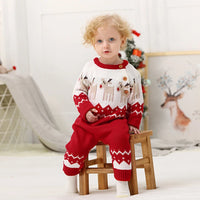 Red and white winter knit rompers for babies with reindeer pattern and button details for toddlers