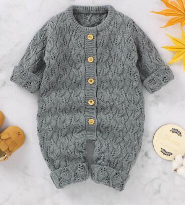 Gray knitted winter romper for babies with long sleeves and wooden buttons