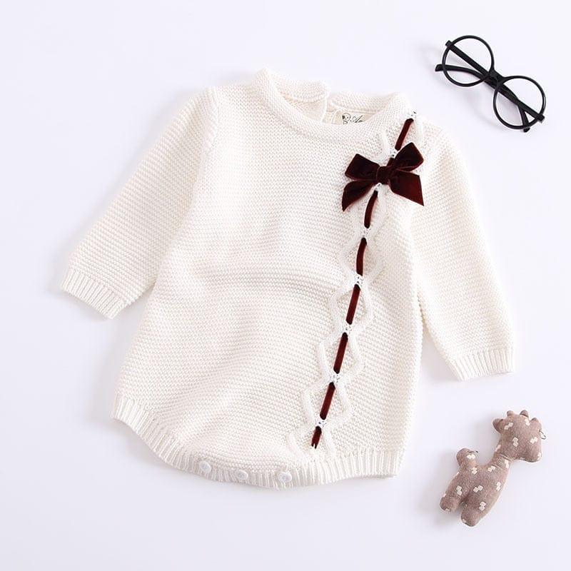 White baby girl knit romper with long sleeves and brown bow detail for infants