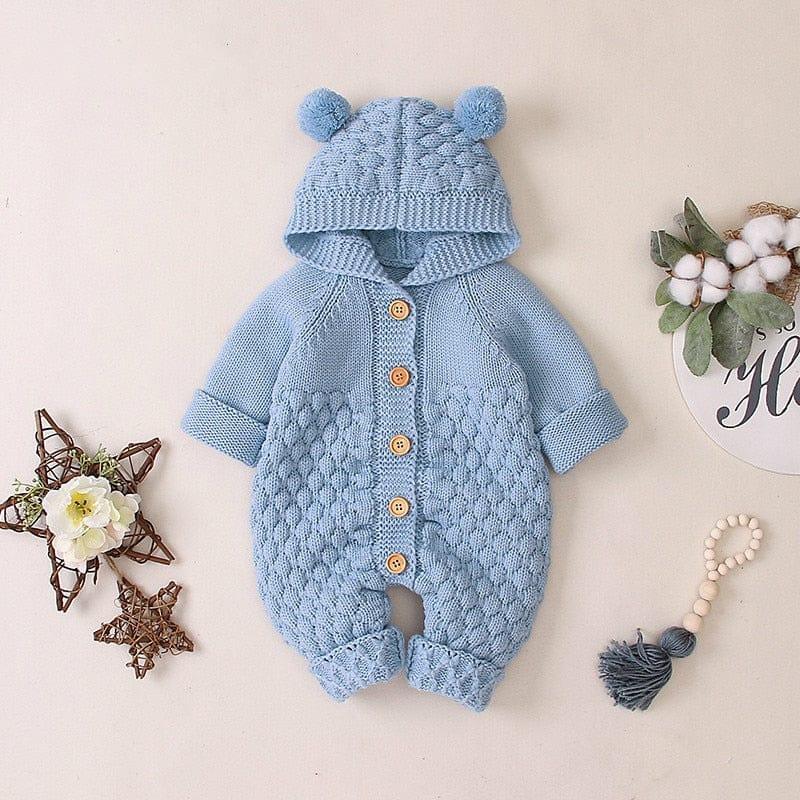 baby hooded knit romper in light blue for infants with textured knit pattern and pom pom ears on hood