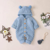 baby hooded knit romper in light blue for infants with textured knit pattern and pom pom ears on hood