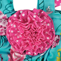 Boho baby summer outfit with turquoise floral pattern and pink polka dot ruffle detail for infants