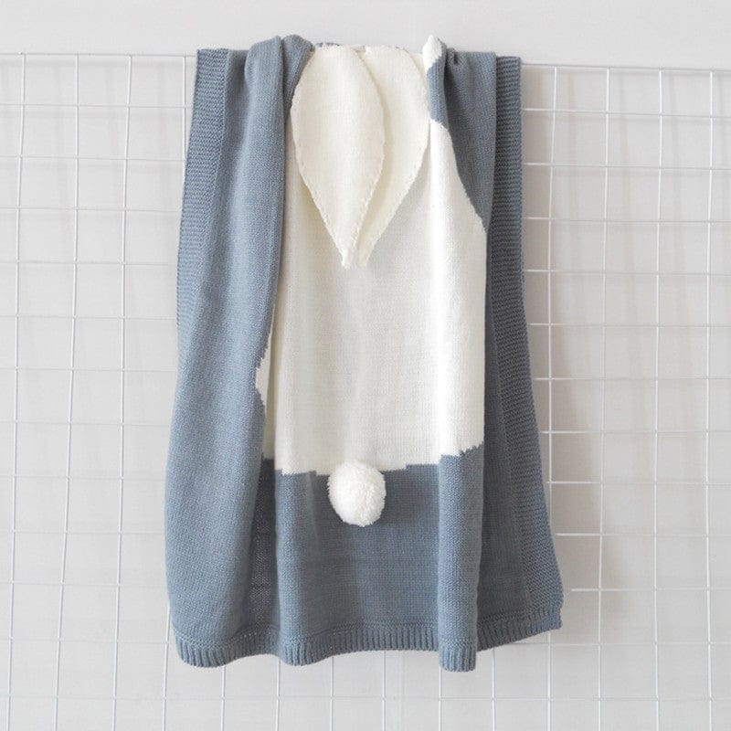Blue and white bunny baby blanket swaddle with soft ears and pom pom tail for newborns