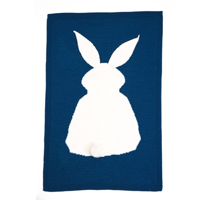 Navy blue bunny baby blanket with white bunny silhouette and pompom tail for infants