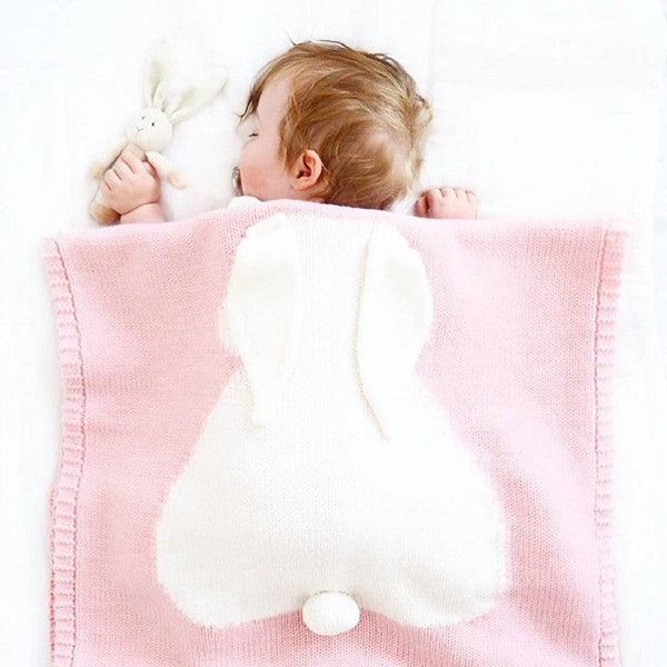 Pink and white bunny baby blanket swaddle for newborns with cute bunny tail detail
