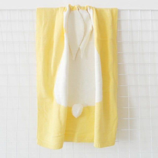 Yellow bunny baby blanket swaddle for newborns with soft knit fabric and bunny ears detail