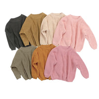 Assorted children's knit pullover sweaters in muted colors for toddlers with ribbed texture and long sleeves