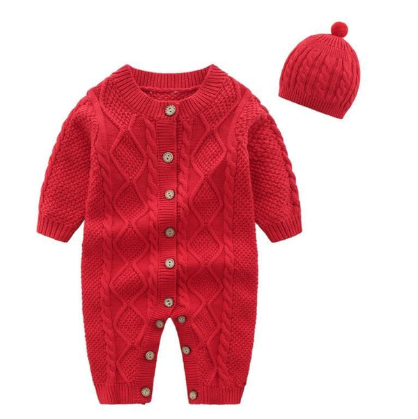 Red knitted baby romper set with cable knit pattern and matching pom pom hat for infants