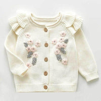 Cream crocheted floral baby romper set with pink and gray flower details and ruffled shoulders for infants