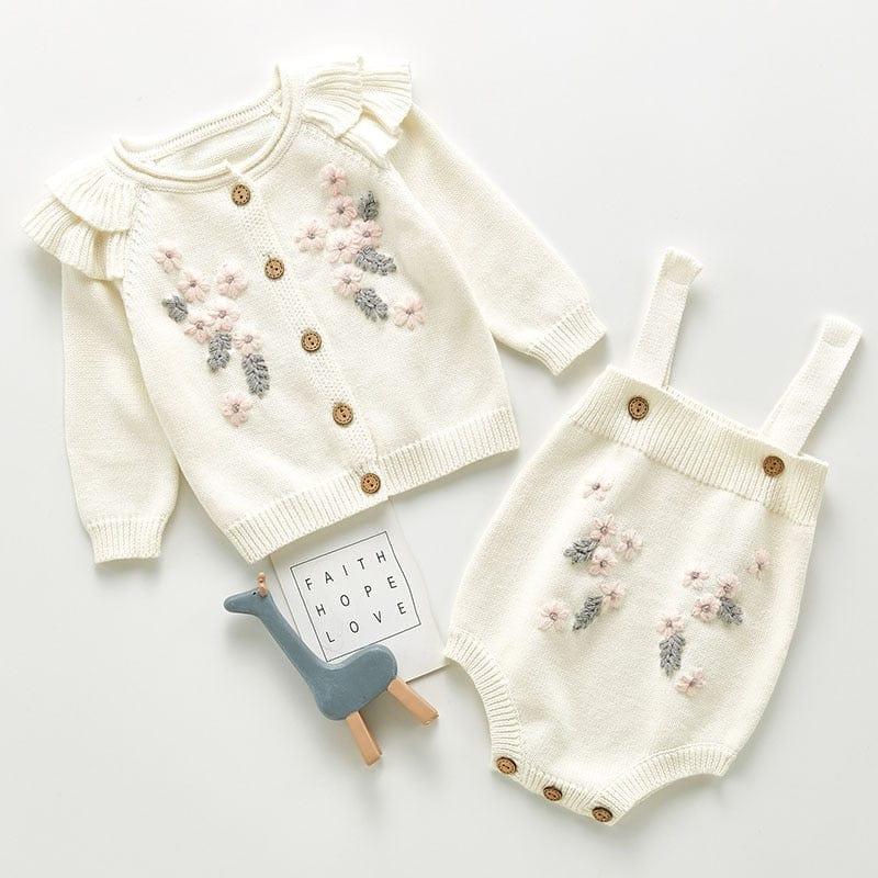 Cream crocheted floral baby romper set with pink and gray flower details for infants 0-12 months