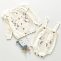 Cream crocheted floral baby romper set with pink and gray flower details for infants 0-12 months