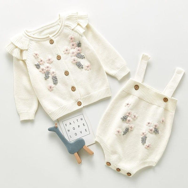 Cream crocheted floral baby romper set with pink and gray flower details for infants 0-12 months