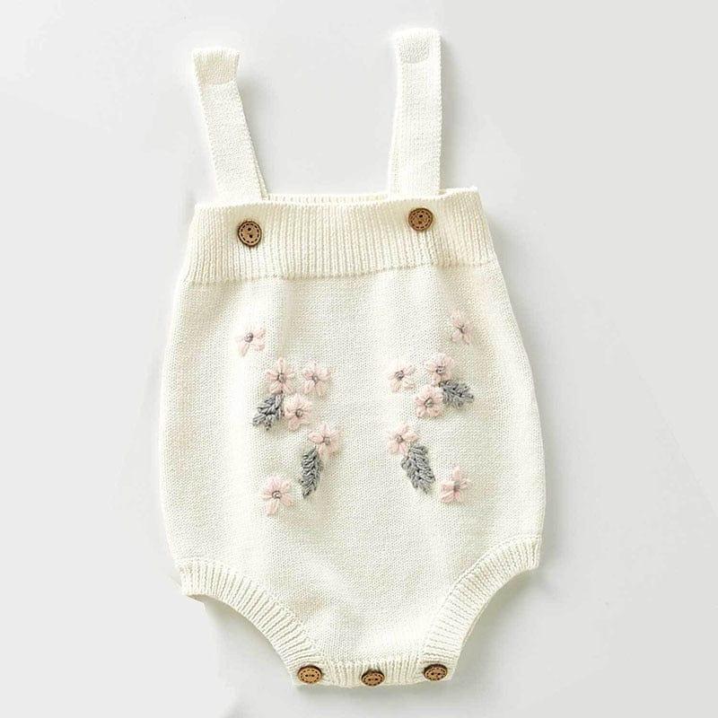 cream crocheted floral baby romper set with pink and gray flower details for infants