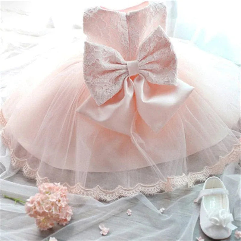baby girl tulle dress with bow in soft pink for infants with lace detailing
