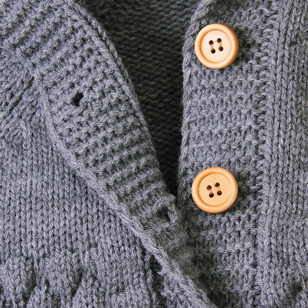 gray hooded knitted romper for babies with wooden buttons and textured knit pattern