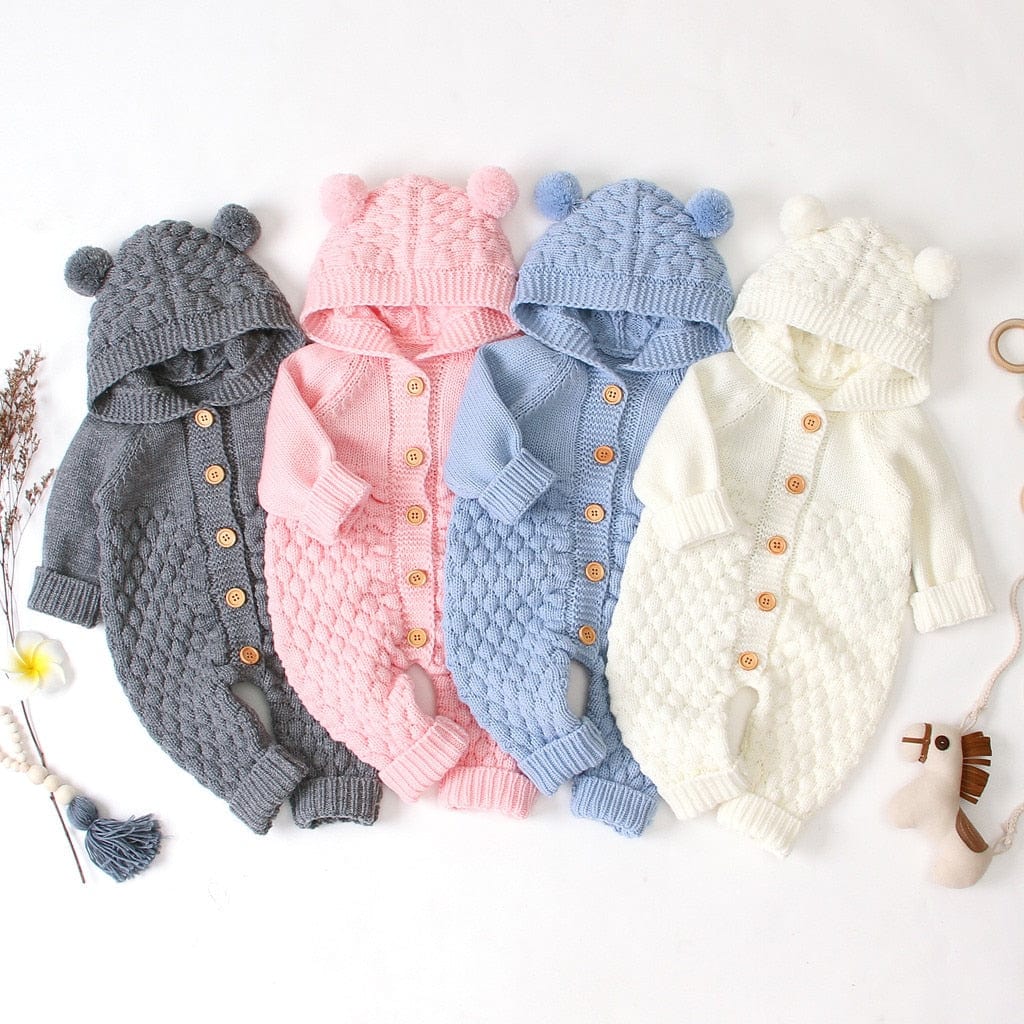 Hooded knitted romper for babies in gray pink blue and white, size newborn to 12 months, with pom pom hood and button front