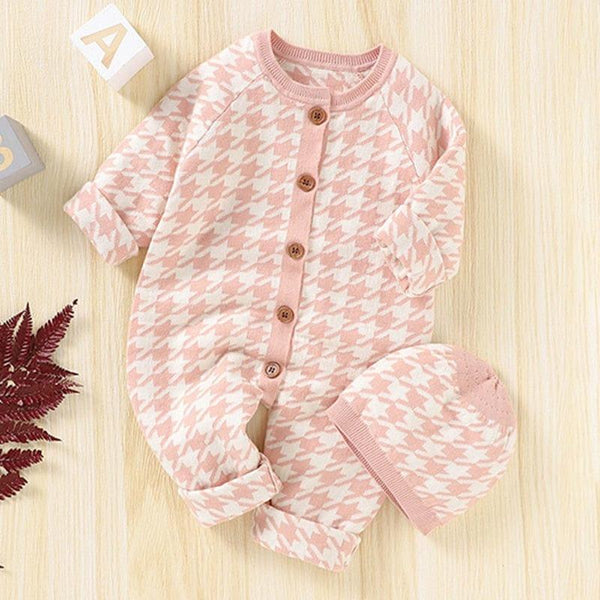 Pink and white houndstooth baby romper set with long sleeves and matching hat for infants