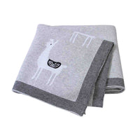 gray soft knitted baby blanket for infants with white llama design and striped border
