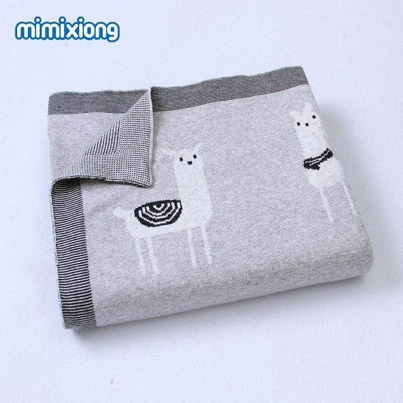 Gray soft knitted baby blanket with white llama design, suitable for infants and toddlers