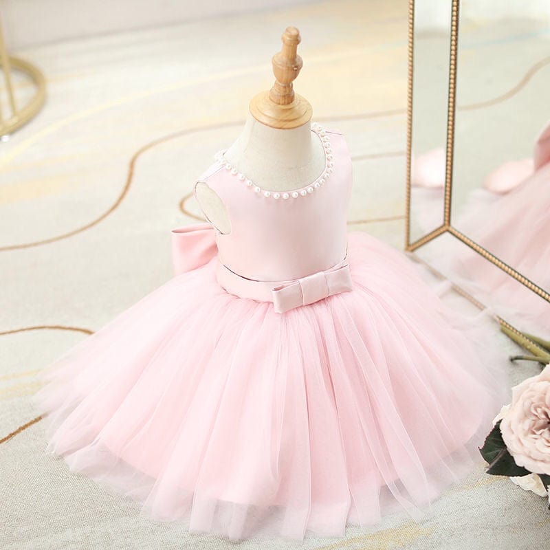 pink baby girl special occasion dress with pearl neckline and bow belt for toddler girls