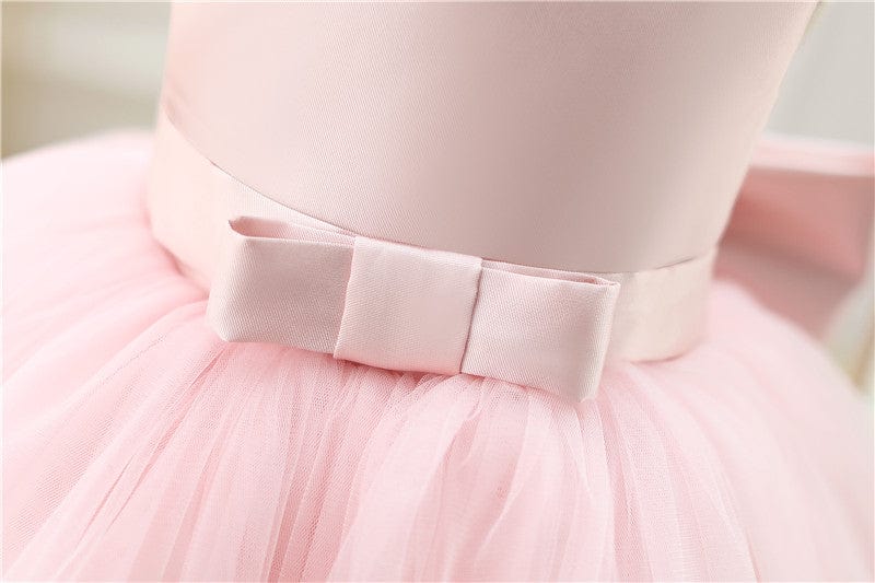 Light pink baby girl special occasion dress with satin bow and tulle skirt for infants