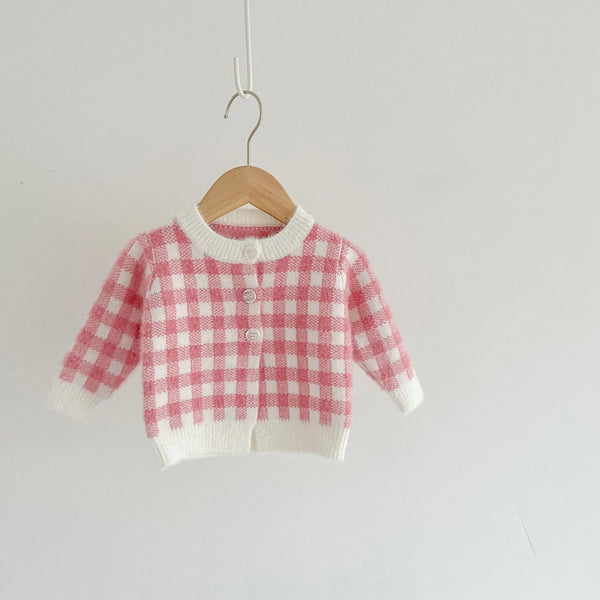 pink knitted romper and sweater set for babies with checkered pattern and button closure