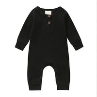 Black ribbed knit baby toddler romper with long sleeves and button details