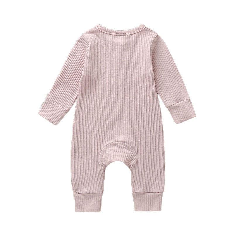 pink ribbed knit baby toddler romper with long sleeves and cuffed legs for infants