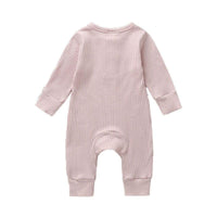 pink ribbed knit baby toddler romper with long sleeves and cuffed legs for infants