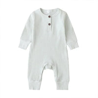 White ribbed knit baby toddler romper with long sleeves and button detail