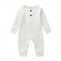 white ribbed knit baby toddler romper with long sleeves and button details